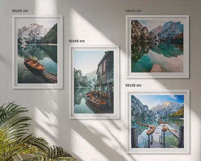 Wall art set featuring a lake with mountains, boats, and a cottage