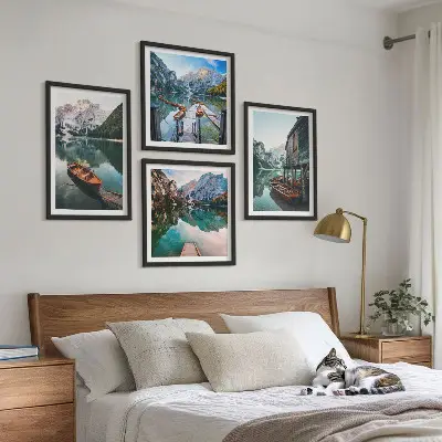 Wall art set featuring a lake with mountains, boats, and a cottage