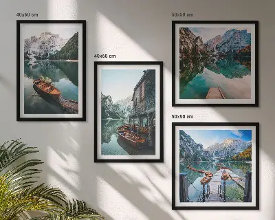 Wall art set featuring a lake with mountains, boats, and a cottage