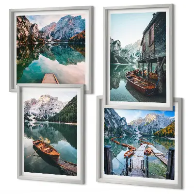 Wall art set featuring a lake with mountains, boats, and a cottage