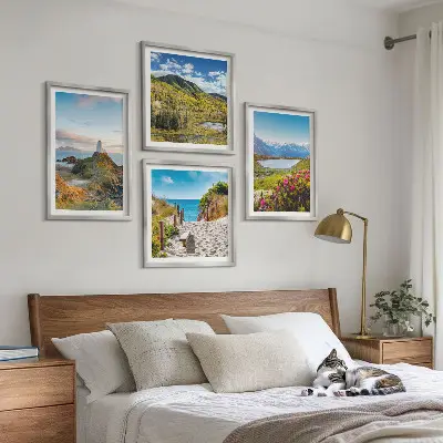 Set of 4 wall art pieces featuring beach, lighthouse, mountain, and meadow flower scenes