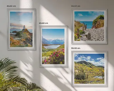 Set of 4 wall art pieces featuring beach, lighthouse, mountain, and meadow flower scenes
