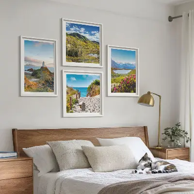 Set of 4 wall art pieces featuring beach, lighthouse, mountain, and meadow flower scenes