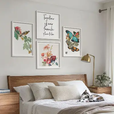 Set of 4 wall art pieces featuring flowers, butterflies, and birds in pastel colors