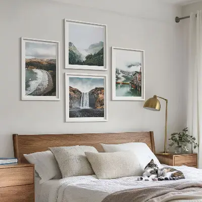 Multi-piece wall art set featuring a mountain, beach, and cloud landscape