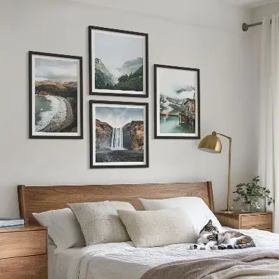 Multi-piece wall art set featuring a mountain, beach, and cloud landscape