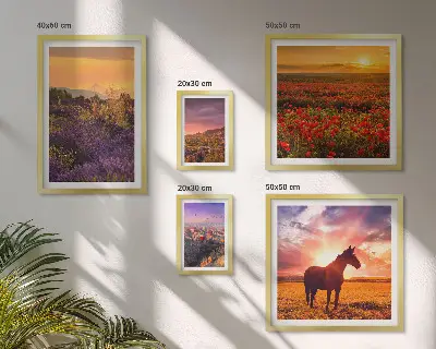 Gallery wall featuring landscape scenes of nature, horses, and flowers