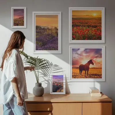 Gallery wall featuring landscape scenes of nature, horses, and flowers
