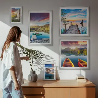 Gallery wall featuring landscape scenes of waterfalls and lakes