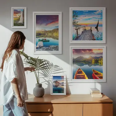 Gallery wall featuring landscape scenes of waterfalls and lakes