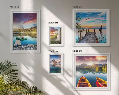 Gallery wall featuring landscape scenes of waterfalls and lakes