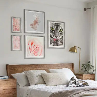 Gallery wall cats and roses in delicate shades