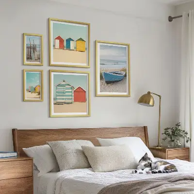 Framed photo set seaside views with houses and boats