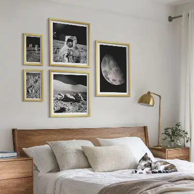 Gallery wall set astronaut-themed lunar landscapes