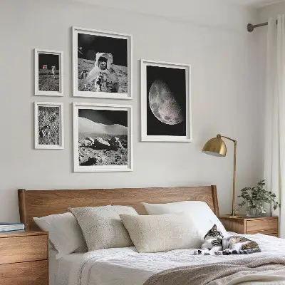 Gallery wall set astronaut-themed lunar landscapes