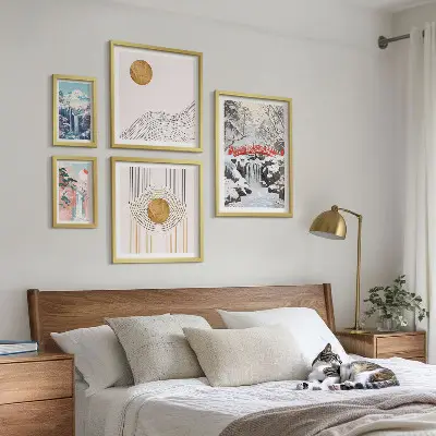 Gallery wall featuring landscape scenes of waterfalls and bridges in Japan