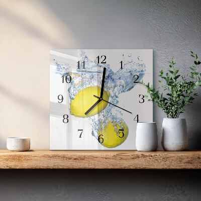 Glass clock square Lemons in water